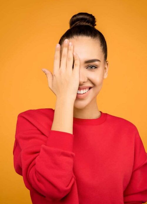 photo of woman covering her face